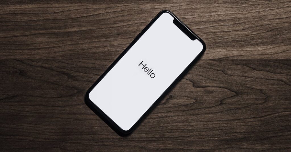 A smartphone displaying 'Hello' on a wooden surface, showcasing modern technology.